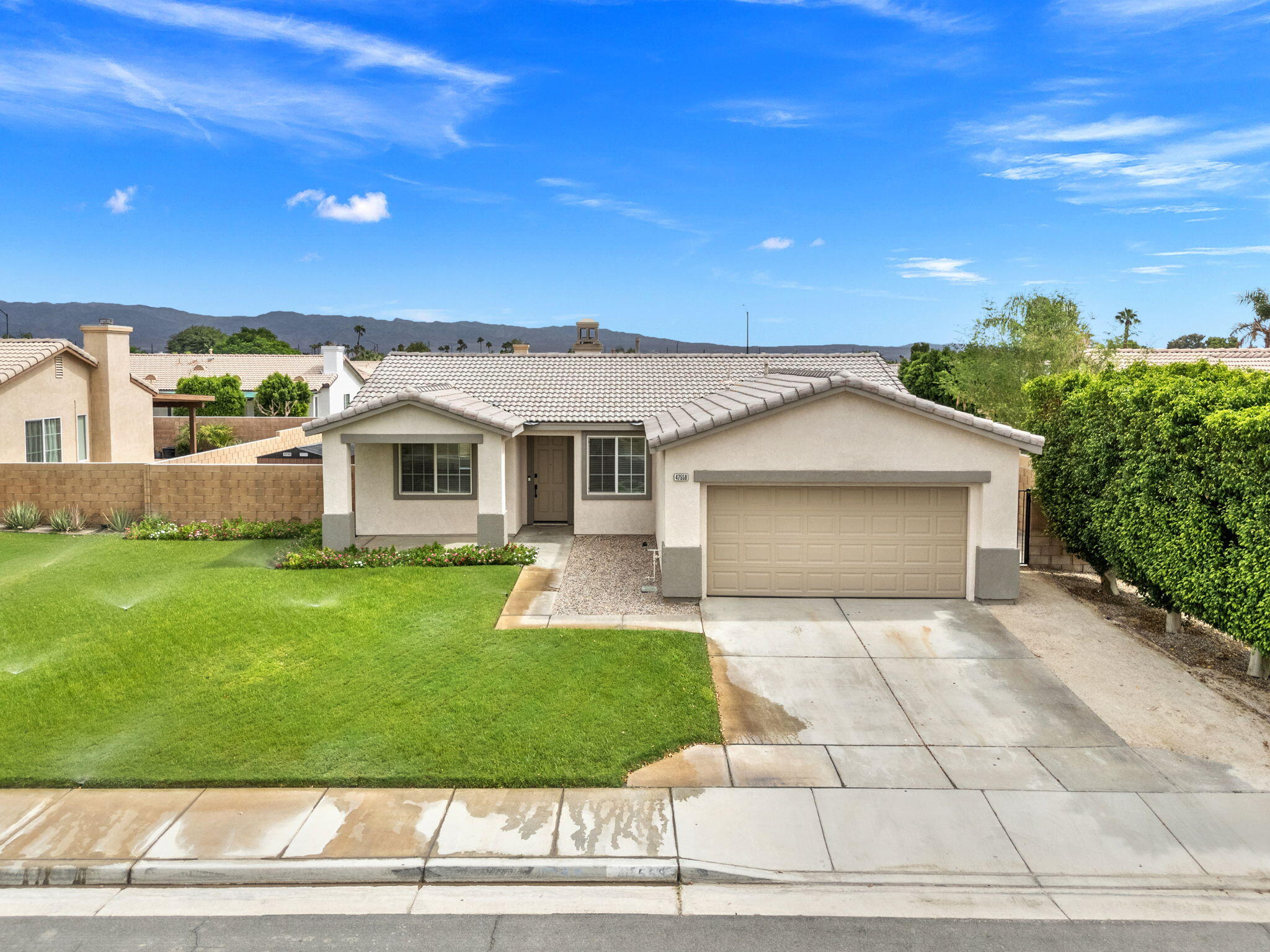 47558 Bison Circle Indio, CA 92201 - Photo 30 of 38 a front view of a house with a yard