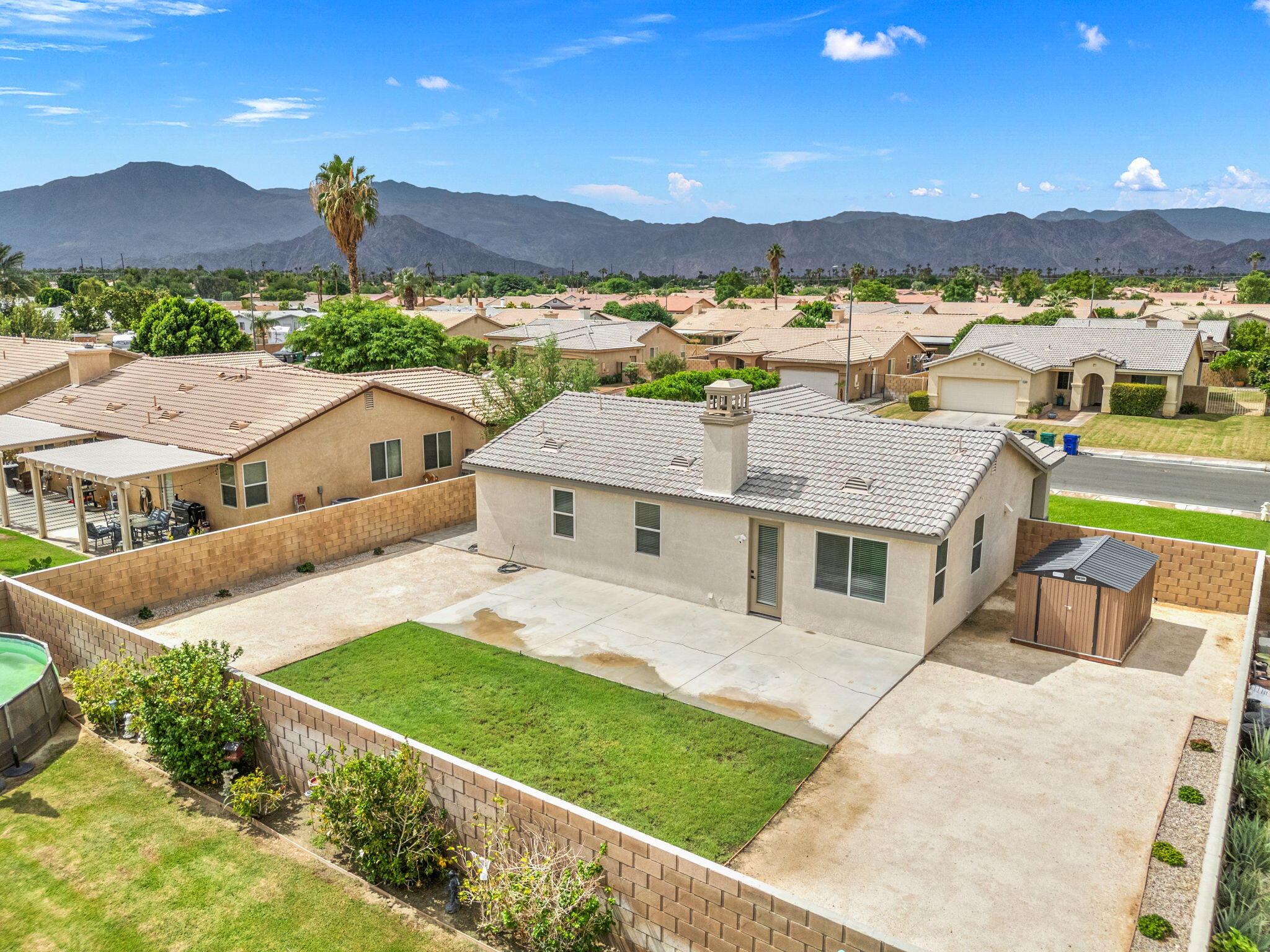 47558 Bison Circle Indio, CA 92201 - Photo 37 of 38 a aerial view of a house with a garden