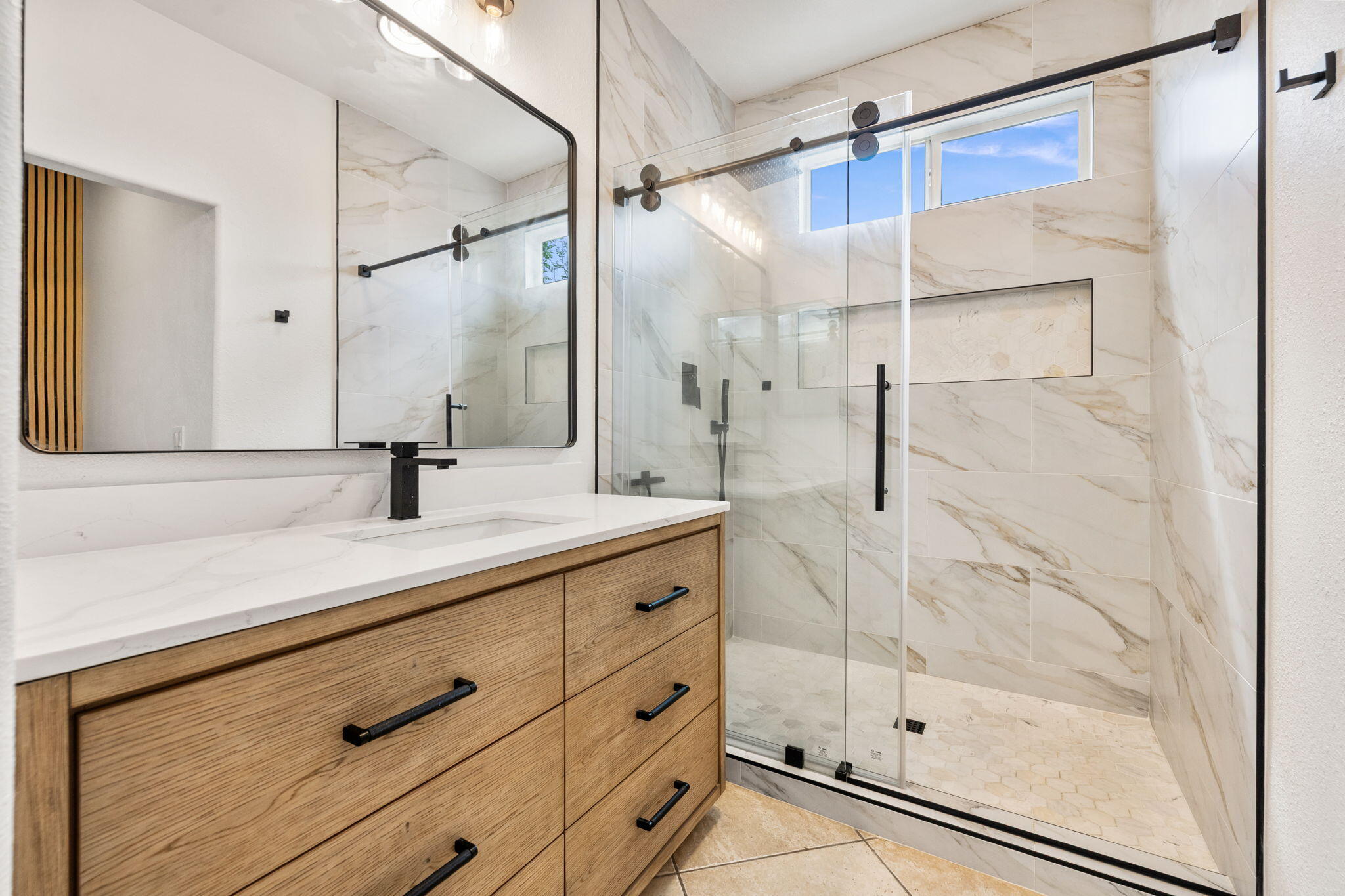 47558 Bison Circle Indio, CA 92201 - Photo 4 of 38 a bathroom with a shower and a sink a mirror