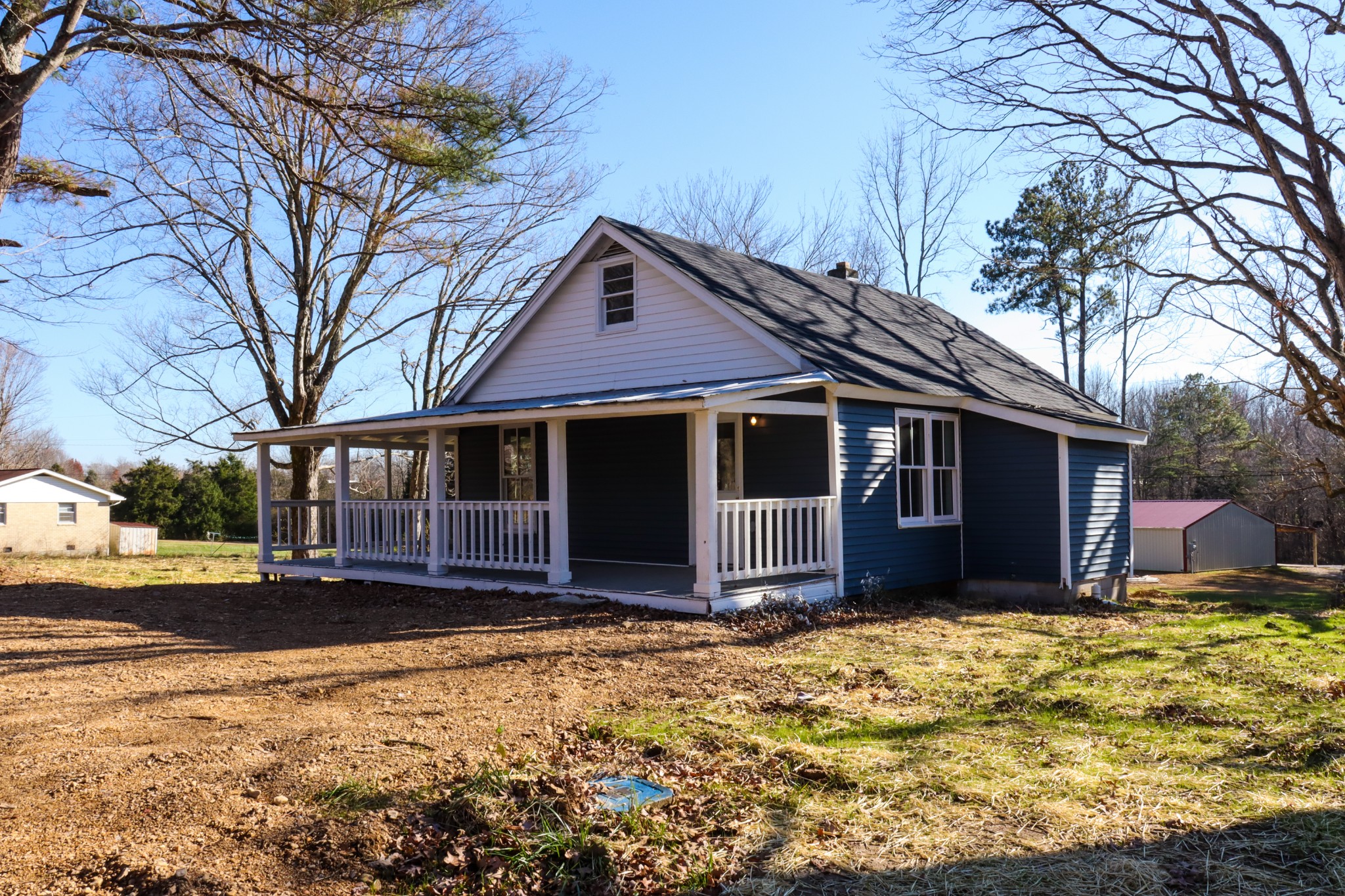 275 Telegraph Street Tennessee Ridge, TN 37178 - Photo 2 of 24 a view of a house with a yard covered in snow
