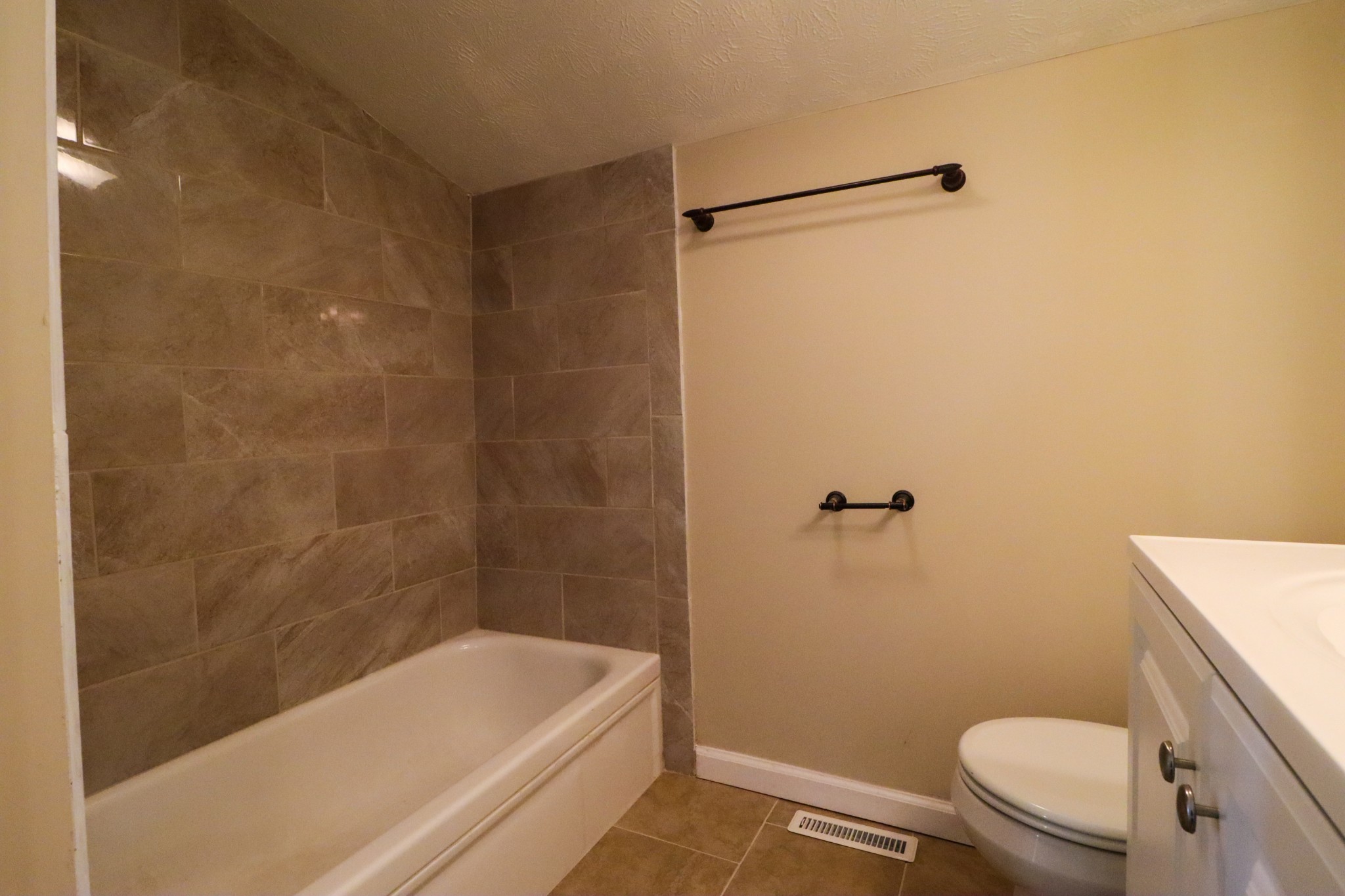275 Telegraph Street Tennessee Ridge, TN 37178 - Photo 12 of 24 a bathroom with a granite countertop toilet and a bathtub