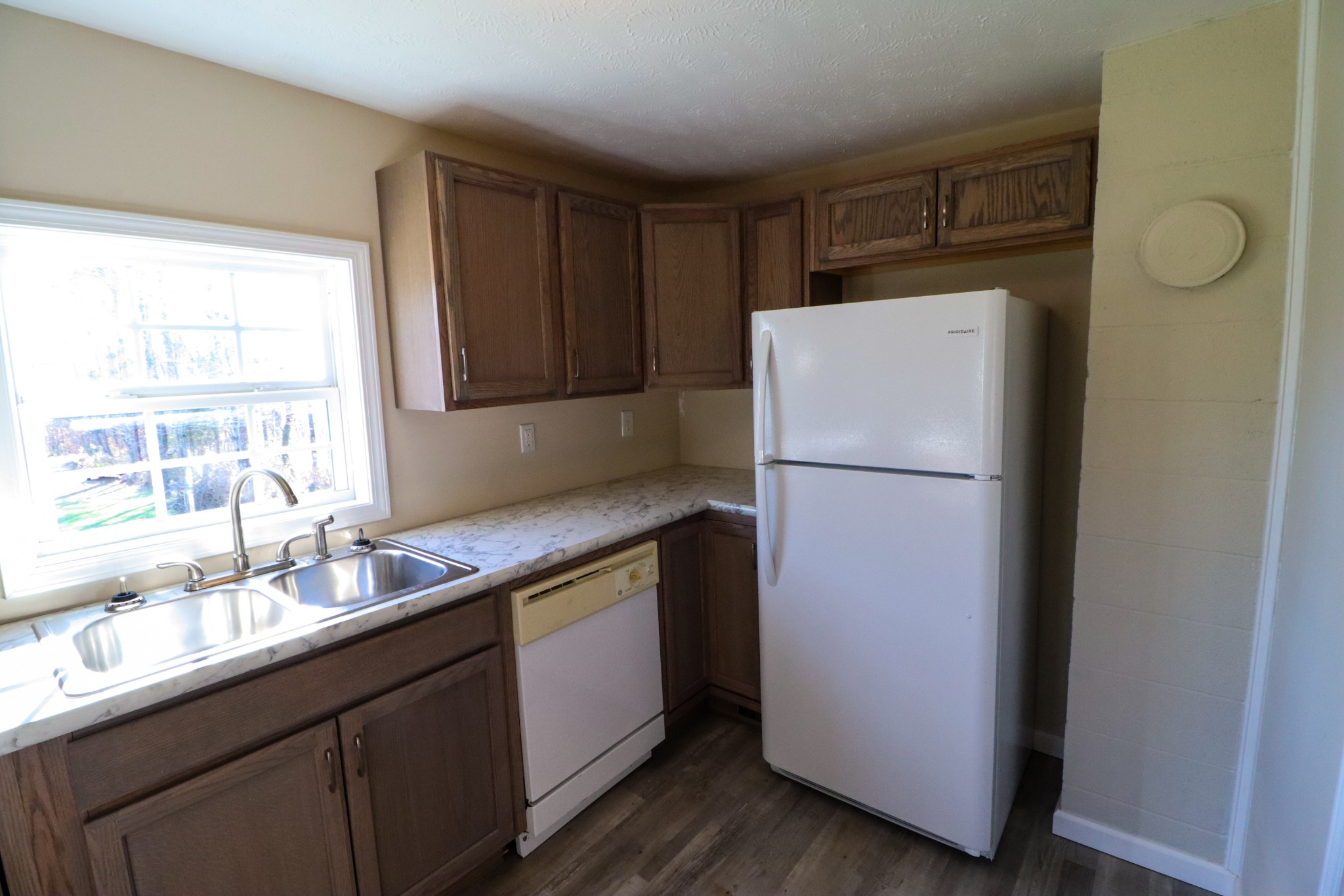 275 Telegraph Street Tennessee Ridge, TN 37178 - Photo 16 of 24 a kitchen with a refrigerator and a sink