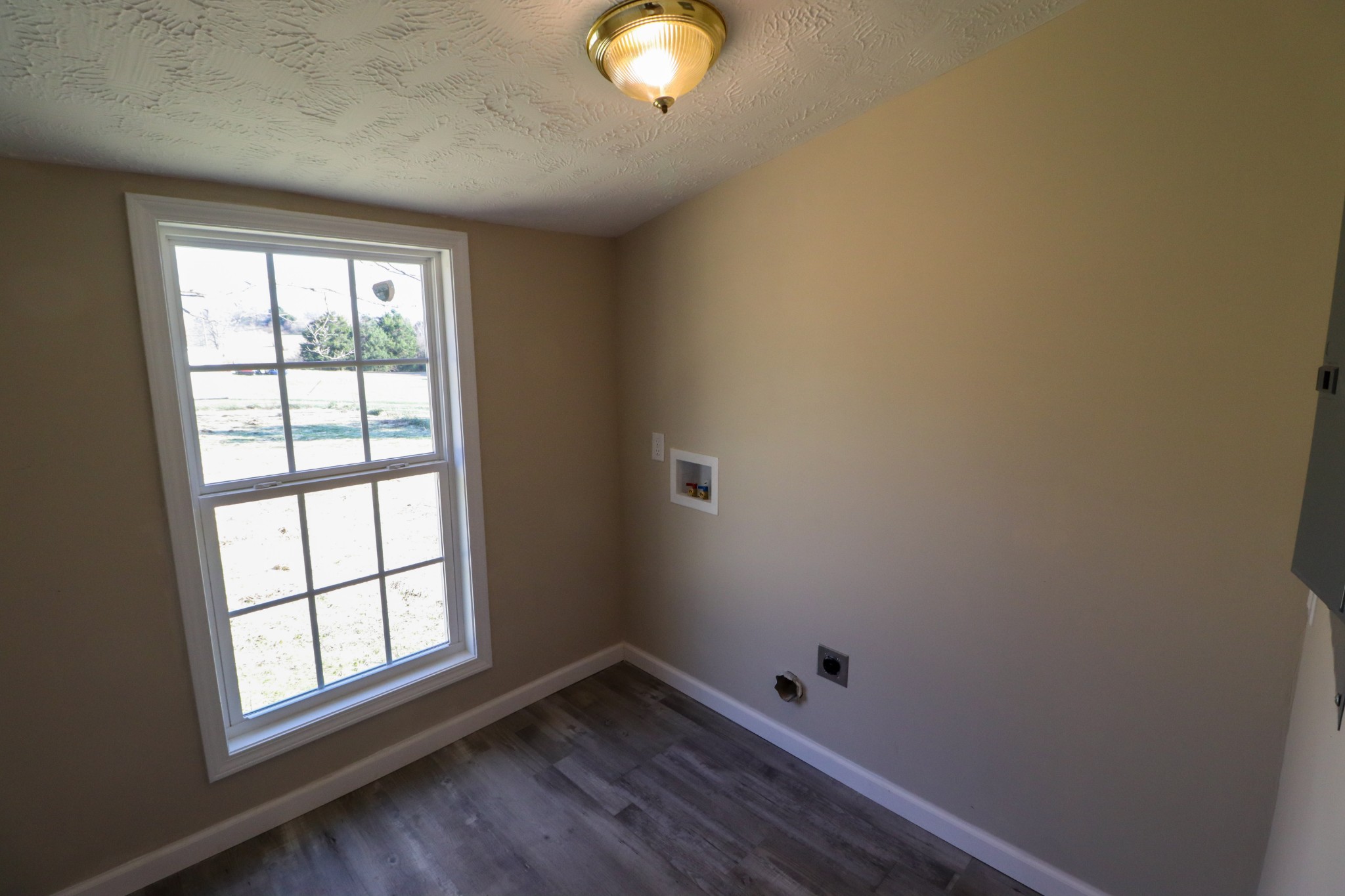 275 Telegraph Street Tennessee Ridge, TN 37178 - Photo 19 of 24 an empty room with wooden floor and windows