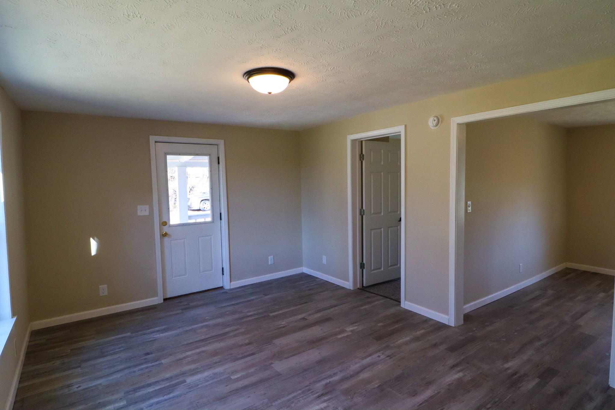 275 Telegraph Street Tennessee Ridge, TN 37178 - Photo 10 of 24 an empty room with wooden floor and windows