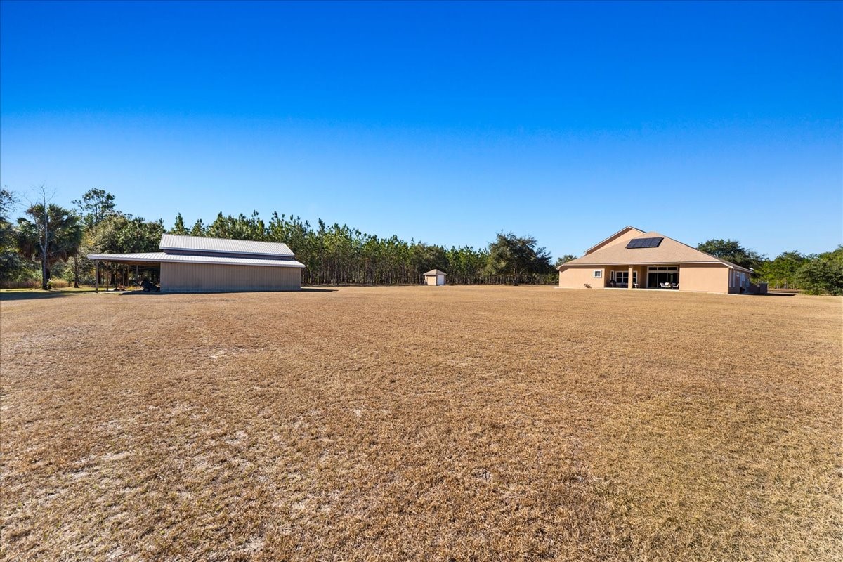 27247 Hallman Road Hilliard, FL 32046 - Photo 10 of 59 a house view with a garden space