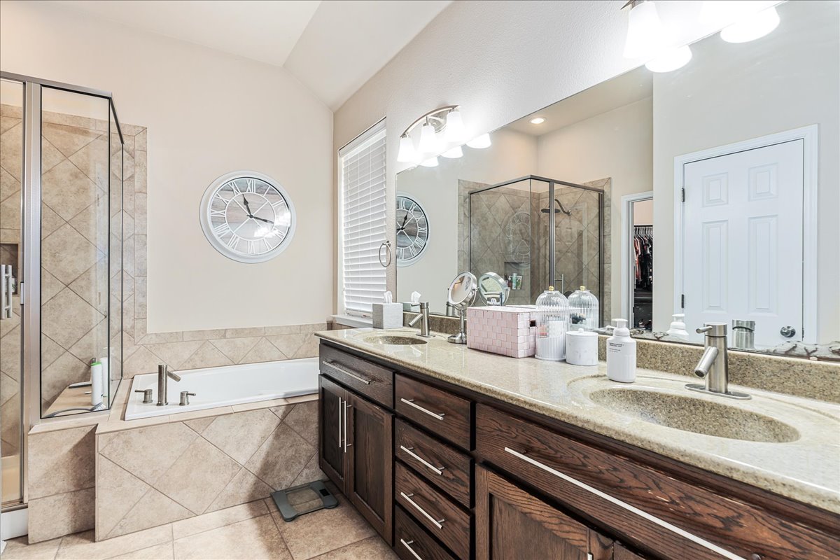137 Navigator Drive Austin, TX 78717 - Photo 12 of 18 a bathroom with a double vanity sink mirror and bathtub