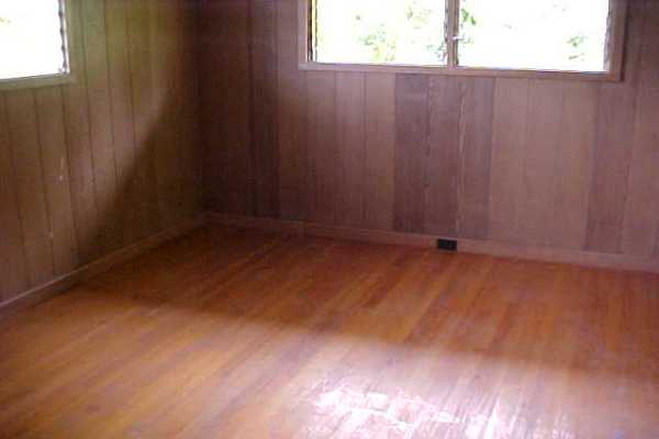18-1190 Volcano Road Mountain View, HI 96771 - Photo 7 of 18 a view of a small space with wooden floor and a window