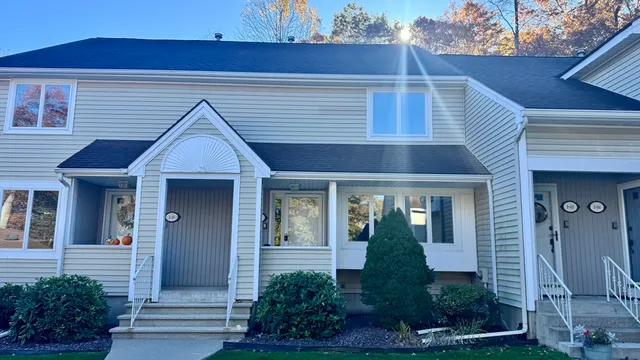 a front view of a house with garden