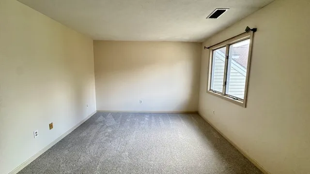 a bathroom with a double vanity sink mirror and toilet