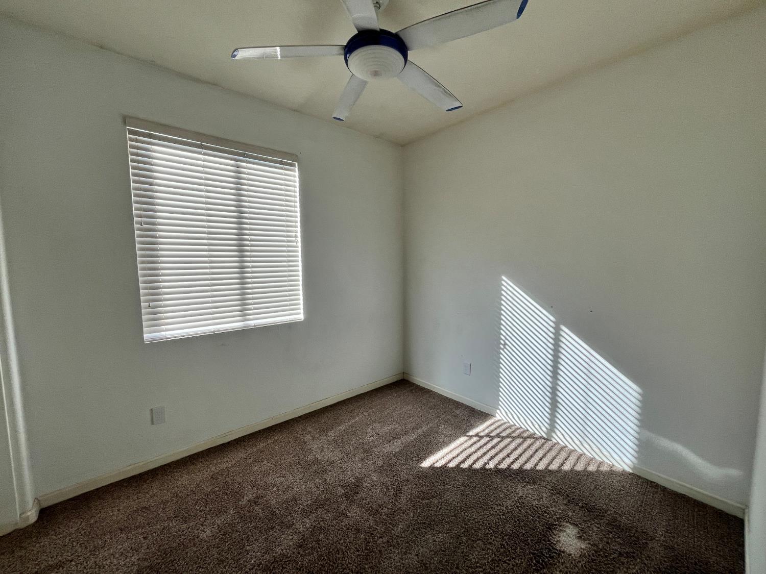 1117 Marsh Wren Court Patterson, CA 95363 - Photo 22 of 41 a view of an empty room with a window