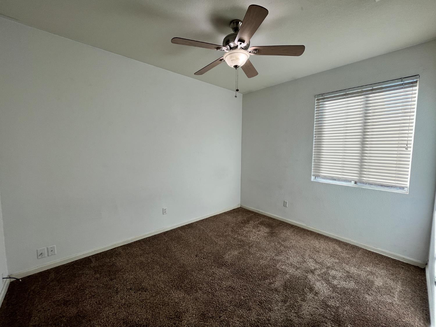 1117 Marsh Wren Court Patterson, CA 95363 - Photo 24 of 41 a view of an empty room with a window