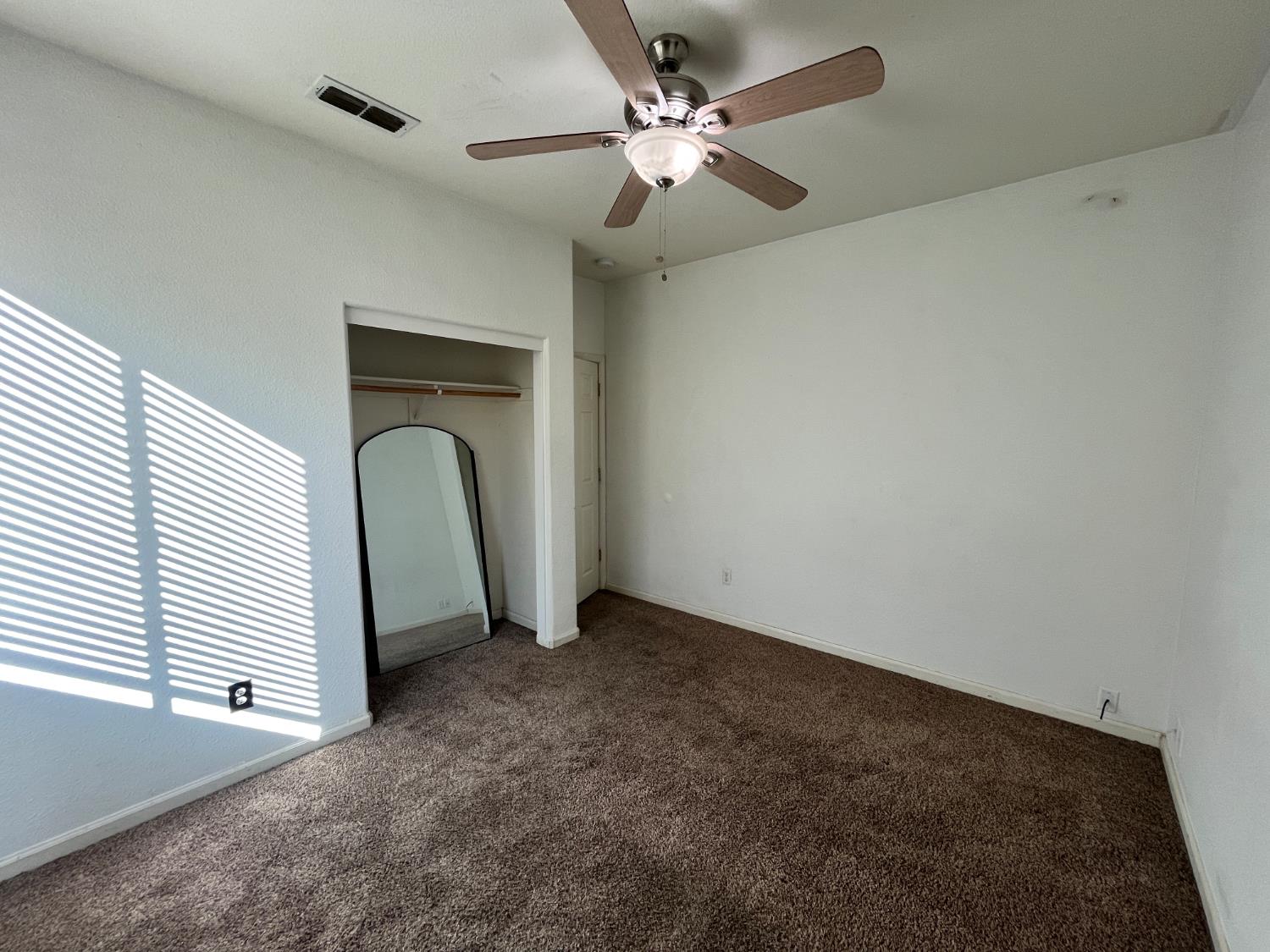 1117 Marsh Wren Court Patterson, CA 95363 - Photo 26 of 41 a view of a livingroom with a ceiling fan and window