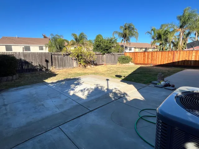 a view of a backyard of the house