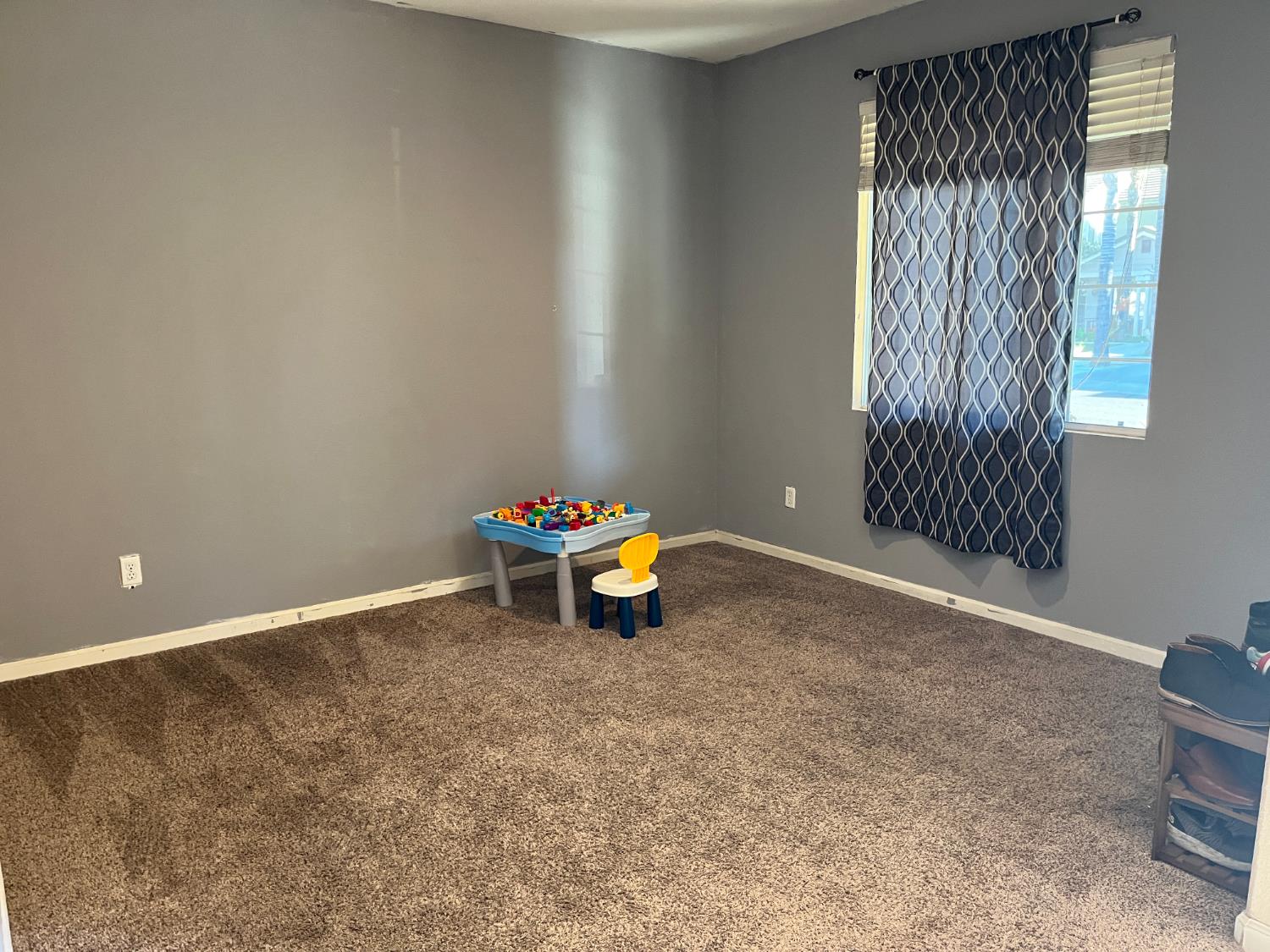 1117 Marsh Wren Court Patterson, CA 95363 - Photo 6 of 41 a view of a room with gym equipment and windows