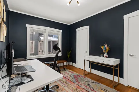 a room with furniture and wooden floor