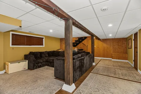 a view of a hallway with the back of the kitchen