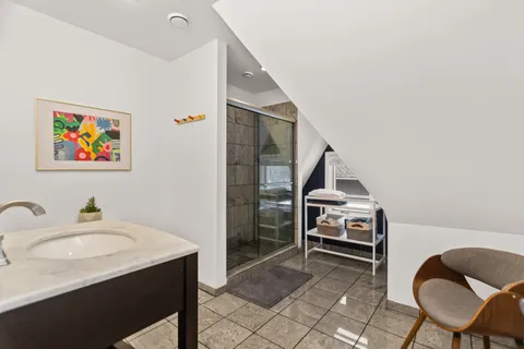 a living room with furniture and a dining table