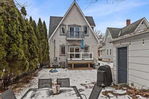 a view of a big house with large windows