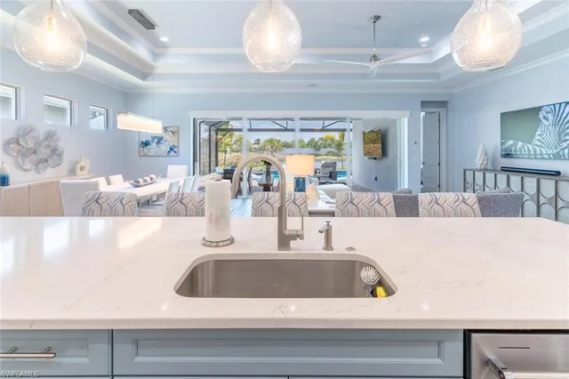 a view of a living room and kitchen