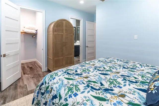 a bedroom with a bed and a dresser