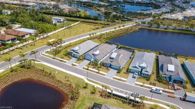 an aerial view of a residential houses with outdoor space