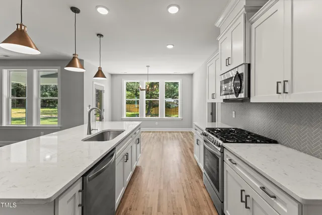 a kitchen with a sink and window