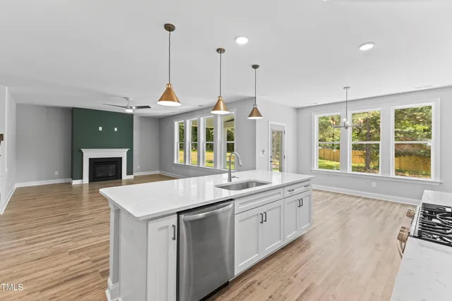 a stove top oven sitting inside of a kitchen