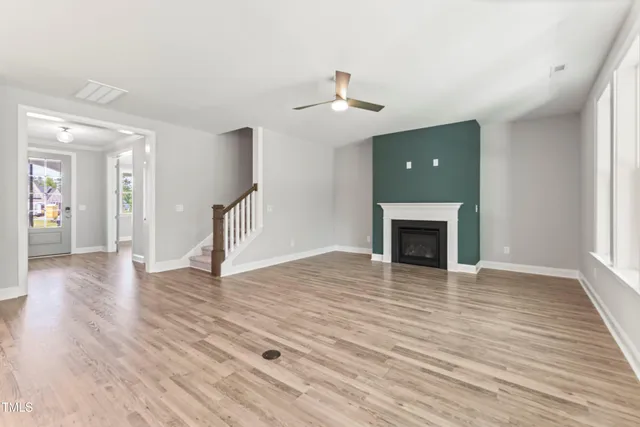 a view of kitchen with wooden floor electronic appliances and window
