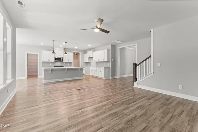 a view of kitchen with wooden floor and window