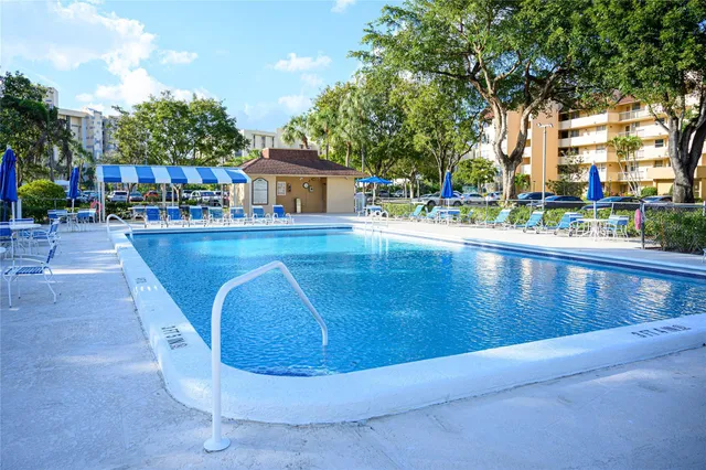 a view of a swimming pool with a patio