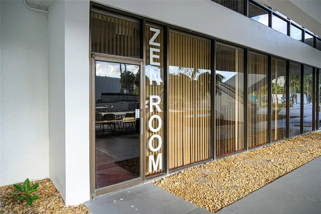 a flower garden is sitting in front of a building