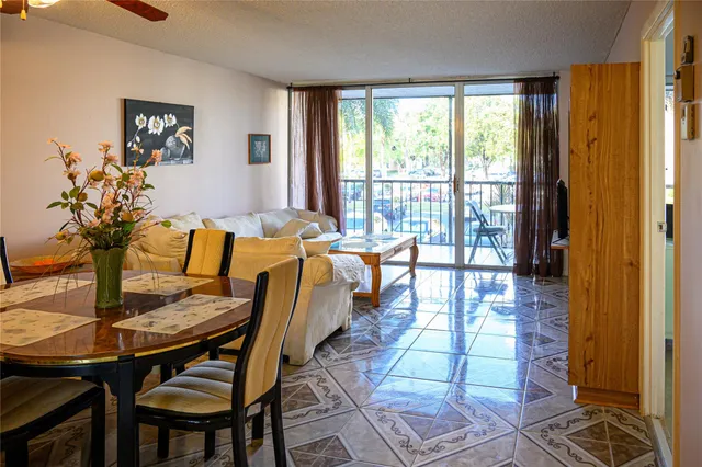 a view of a dining room with furniture window and outside view
