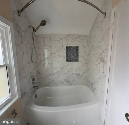 a bathroom with a bathtub