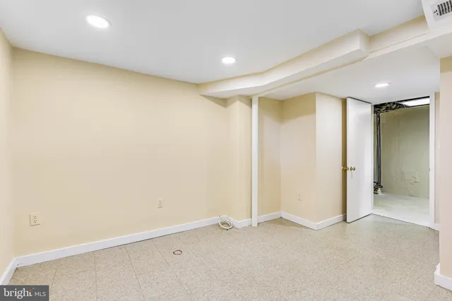 an empty room with glass door