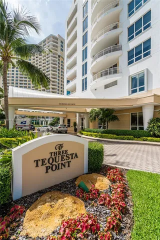 a swimming pool with outdoor seating and yard