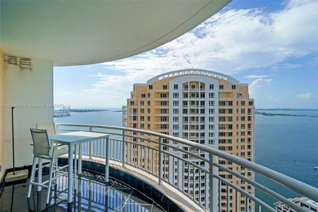 a view of a balcony with table and chairs