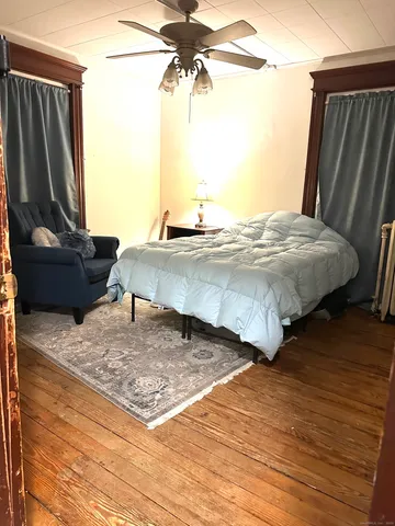 a bedroom with a bed and dresser