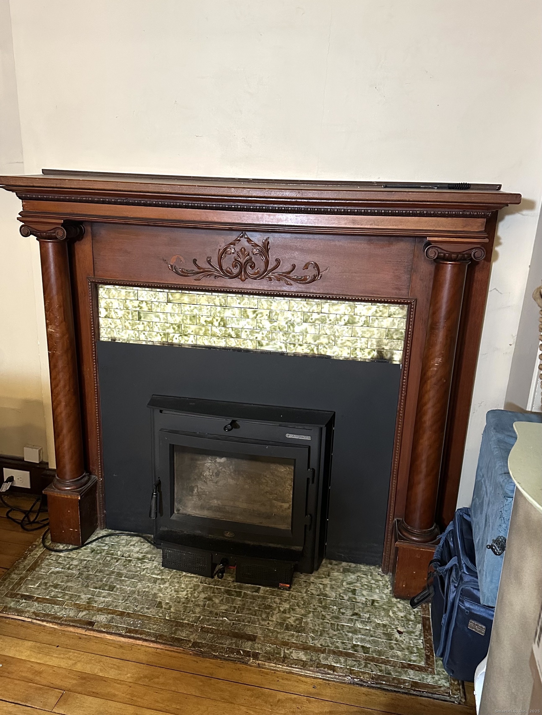 24 Maynard Avenue Waterbury, CT 06708 - Photo 21 of 32 a close view of a fireplace in a room
