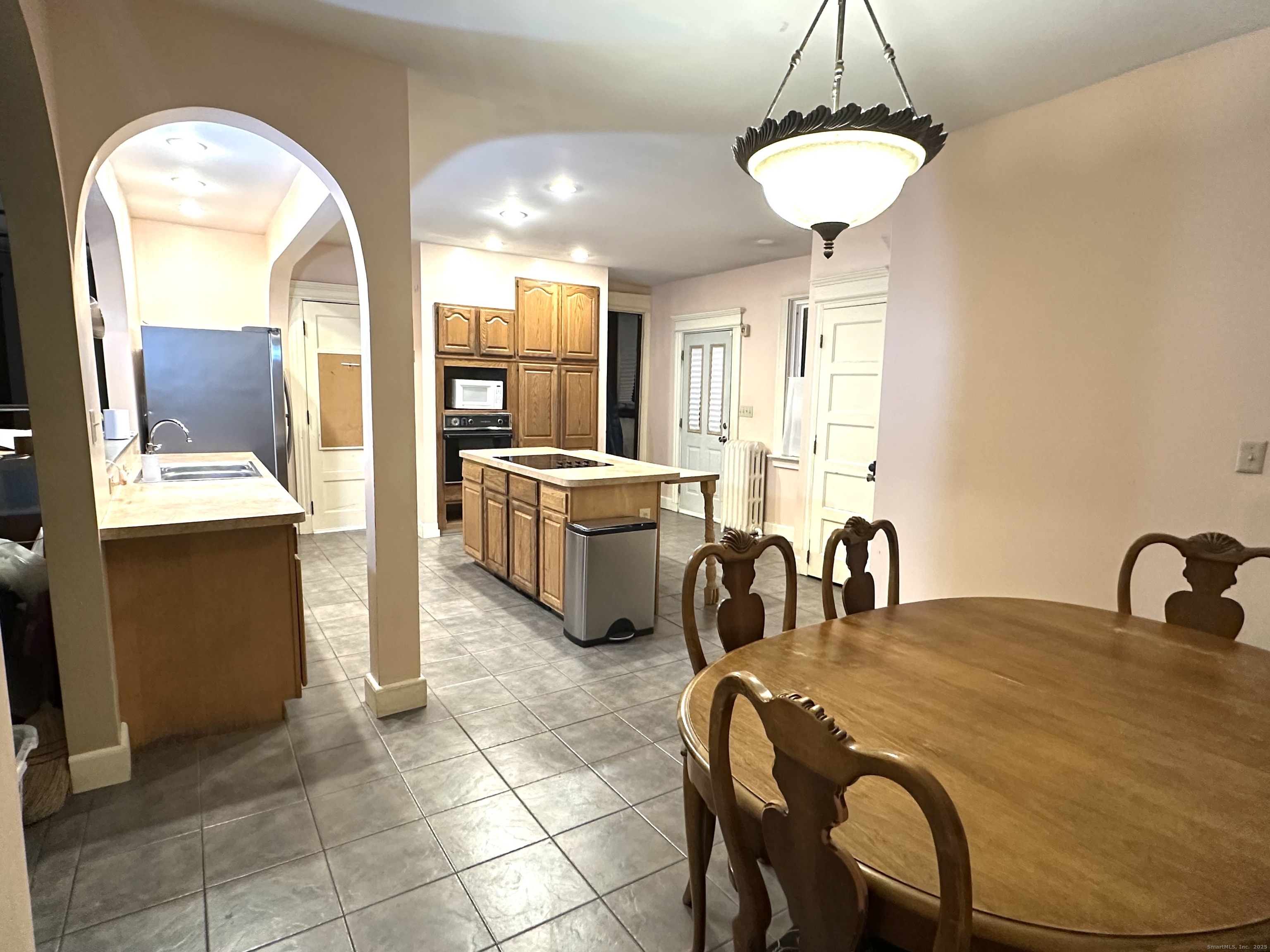 24 Maynard Avenue Waterbury, CT 06708 - Photo 23 of 32 a view of a dining room with furniture and a chandelier