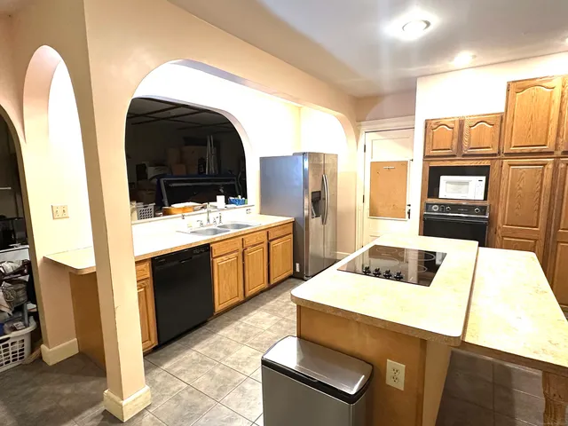 a kitchen that has a stove and a microwave