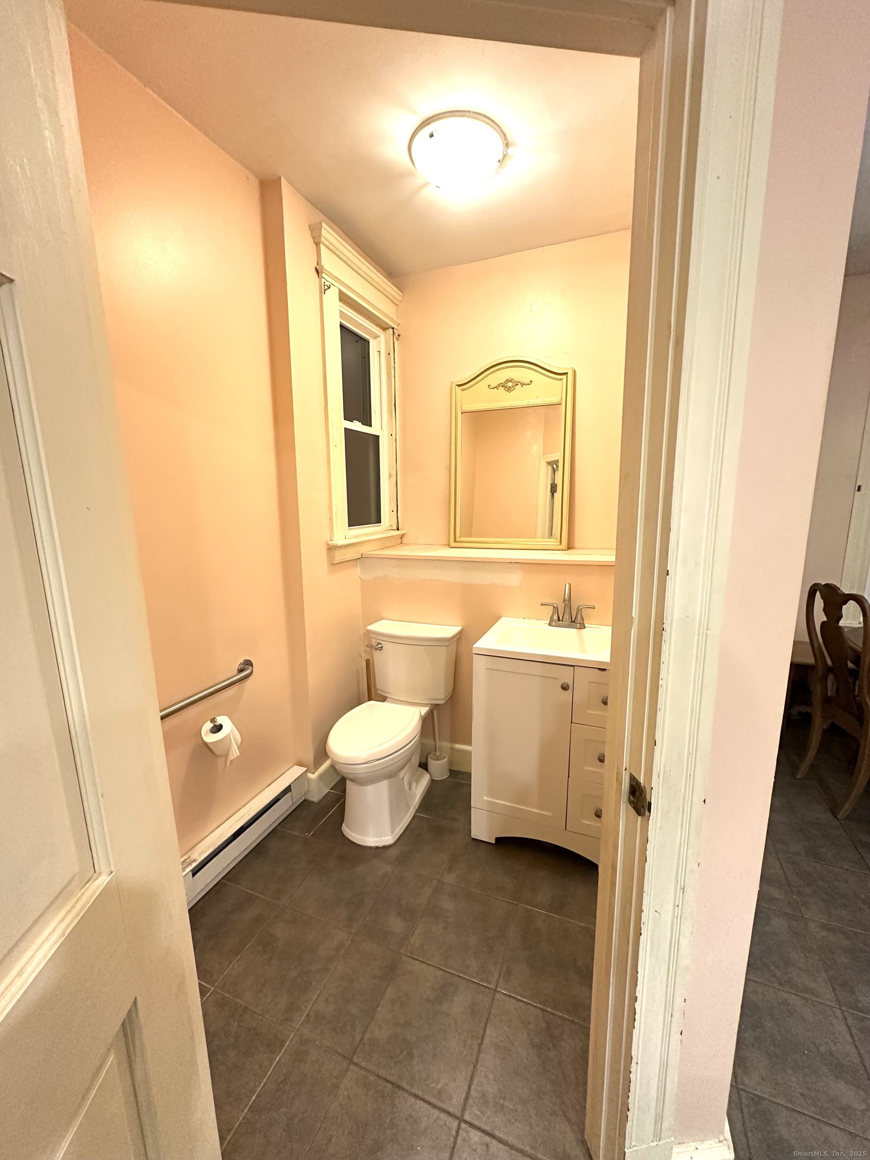 24 Maynard Avenue Waterbury, CT 06708 - Photo 25 of 32 a bathroom with a sink and a mirror