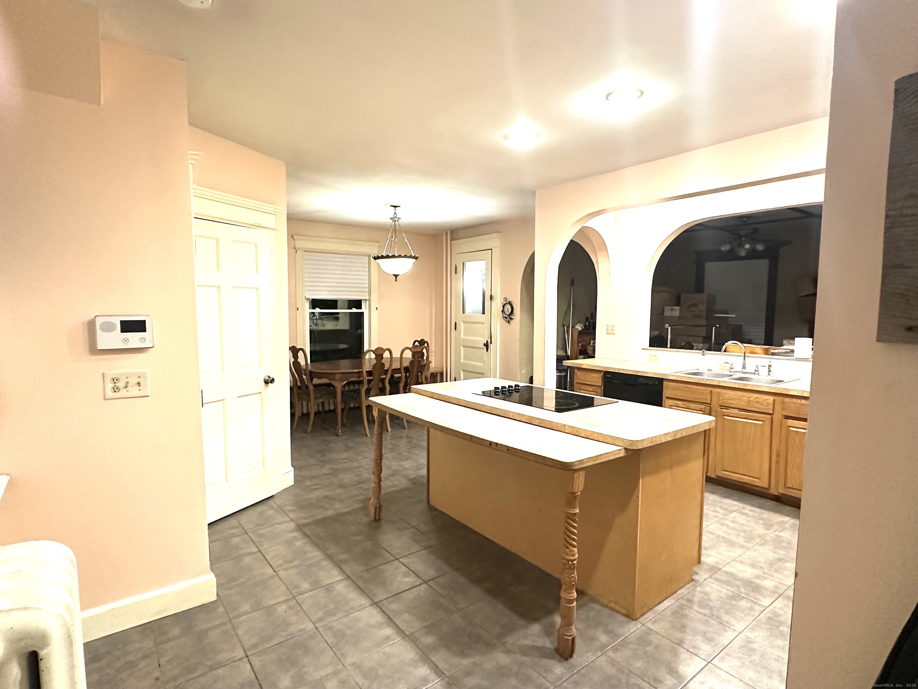 24 Maynard Avenue Waterbury, CT 06708 - Photo 26 of 32 a large white kitchen with a large window