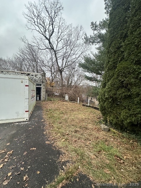 24 Maynard Avenue Waterbury, CT 06708 - Photo 28 of 32 a view of a yard with snow on the road