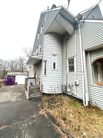 a view of a house with backyard and chair