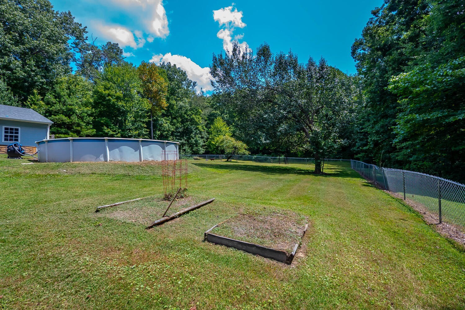 131 Gaskins Road Burns, TN 37029 - Photo 22 of 25 a view of a backyard with a swimming pool