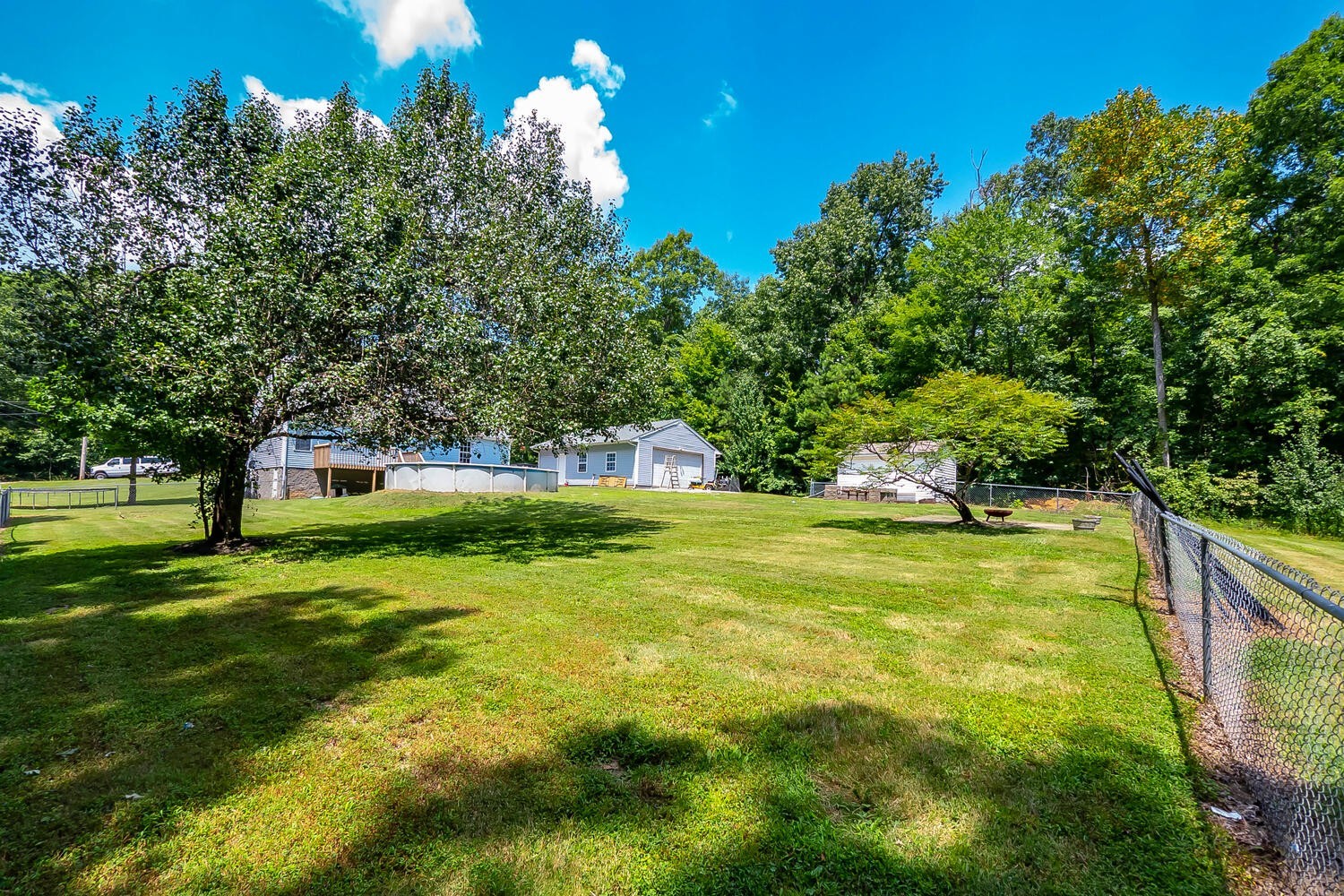 131 Gaskins Road Burns, TN 37029 - Photo 24 of 25 a view of swimming pool and trees in the background