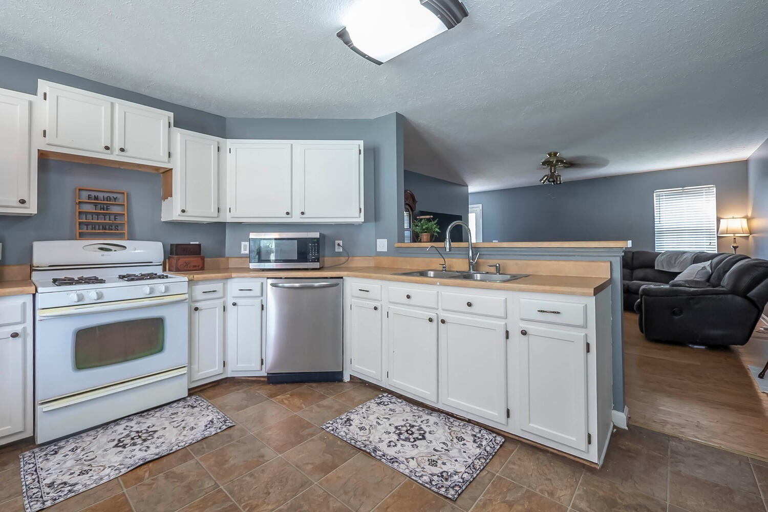 131 Gaskins Road Burns, TN 37029 - Photo 8 of 25 a kitchen with a stove a sink and a refrigerator