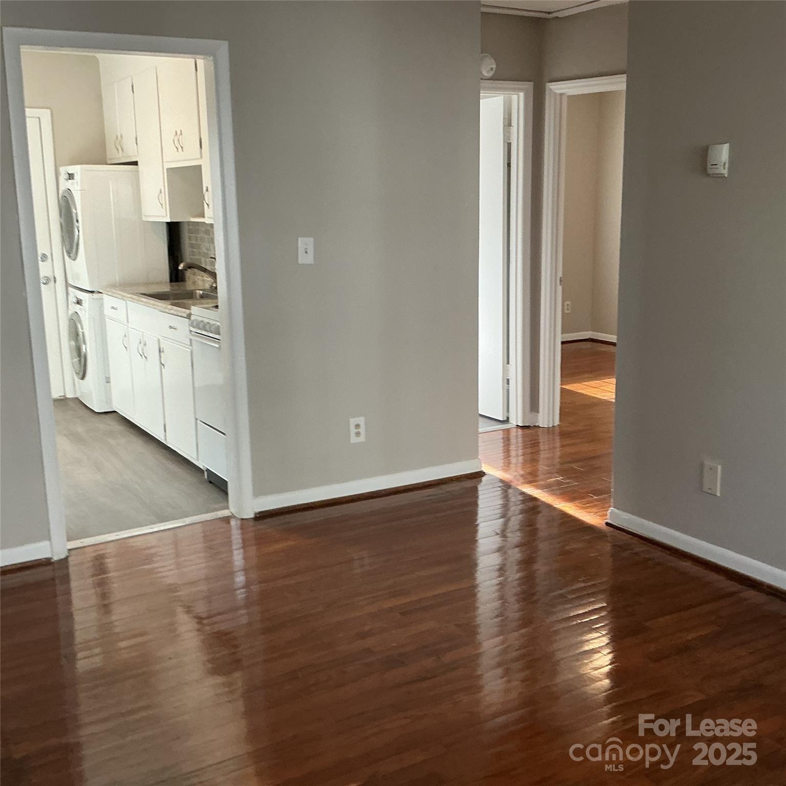 218 Grandin Road, Unit 2 Charlotte, NC 28208 - Photo 3 of 8 a view of a kitchen with wooden floor and a sink