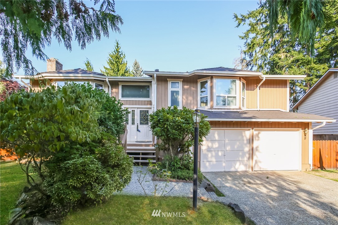 17848 156th Place Southeast Renton, WA 98058 - Photo 1 of 24 a front view of a house with garden