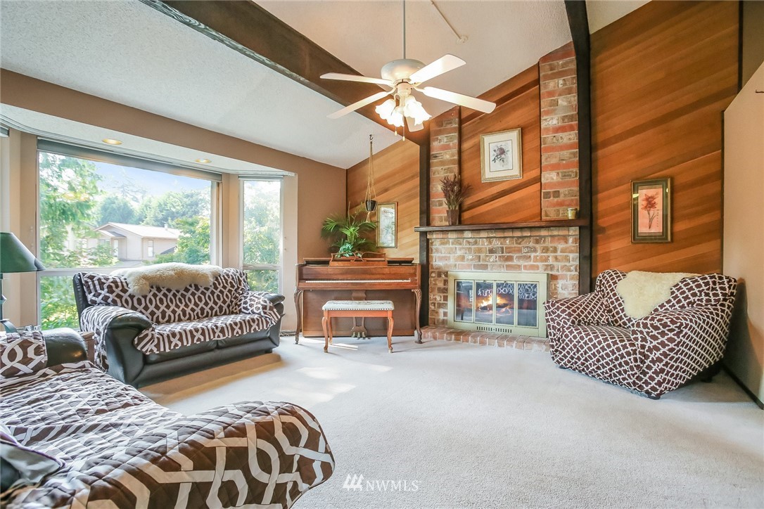 17848 156th Place Southeast Renton, WA 98058 - Photo 2 of 24 a bedroom with furniture and a fireplace